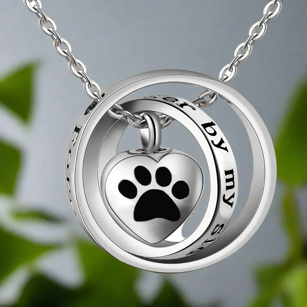 Necklace with urn in the shape of a paw print made of stainless steel
